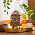 Buddha head with crystals. Balance and calm energy flow in home.