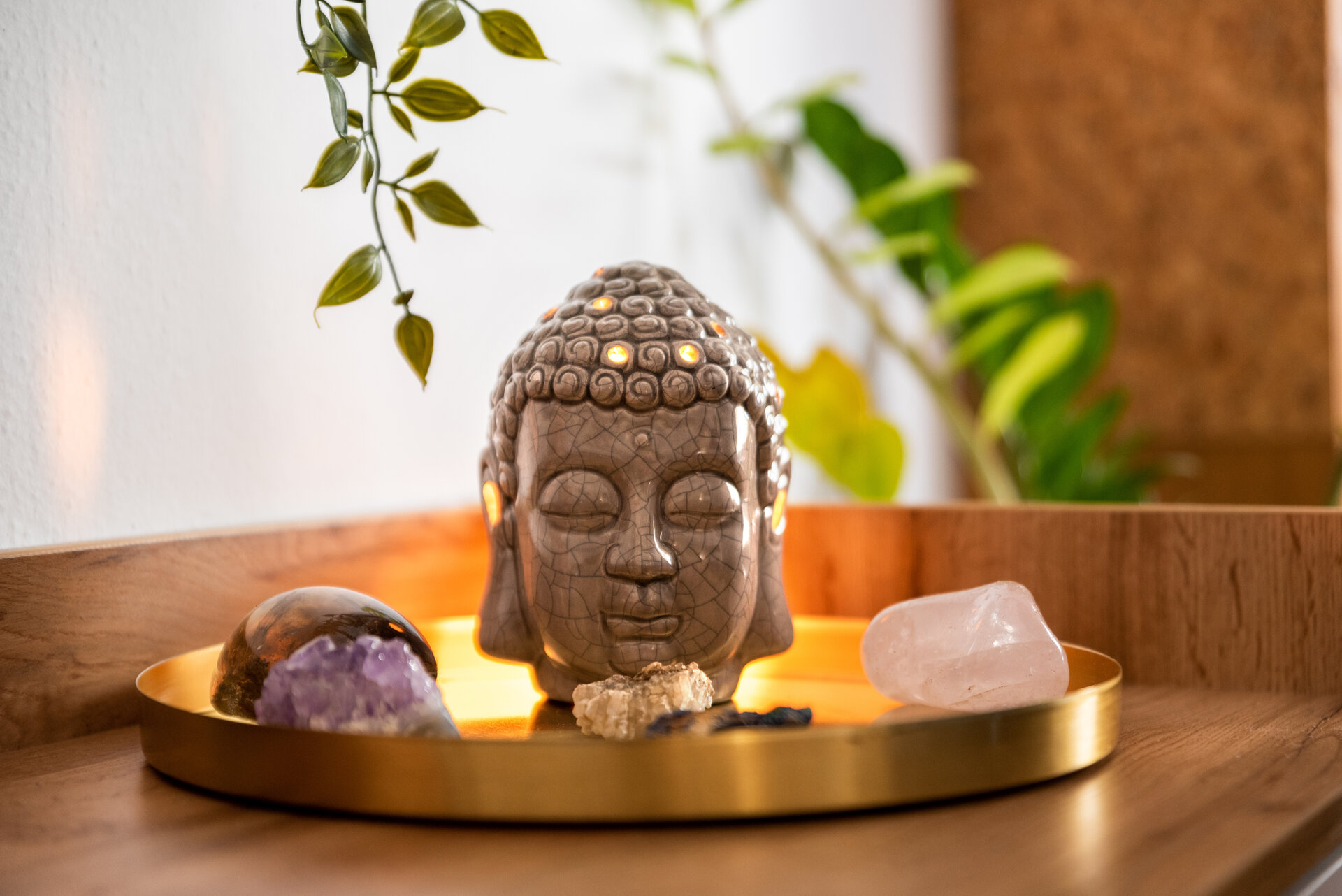 Buddha head with crystals. Balance and calm energy flow in home.